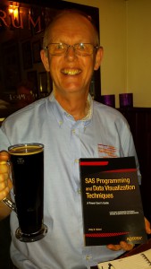 Happiness: my new book, a beer and my advertising shirt at the book launch in Cambridge